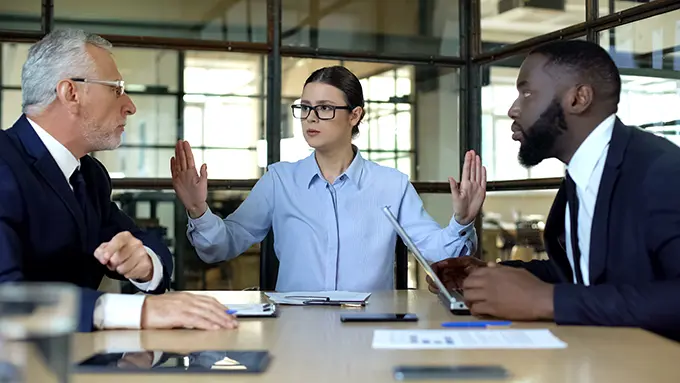 Woman completing conflict resolution between C suite