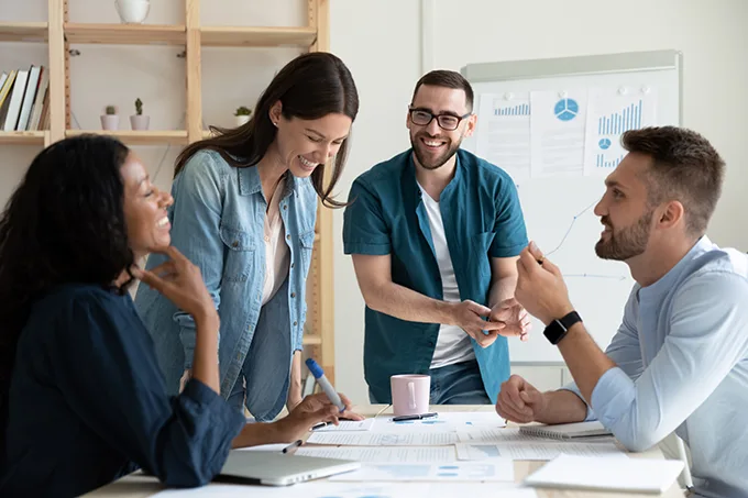 Coworkers talking in open space