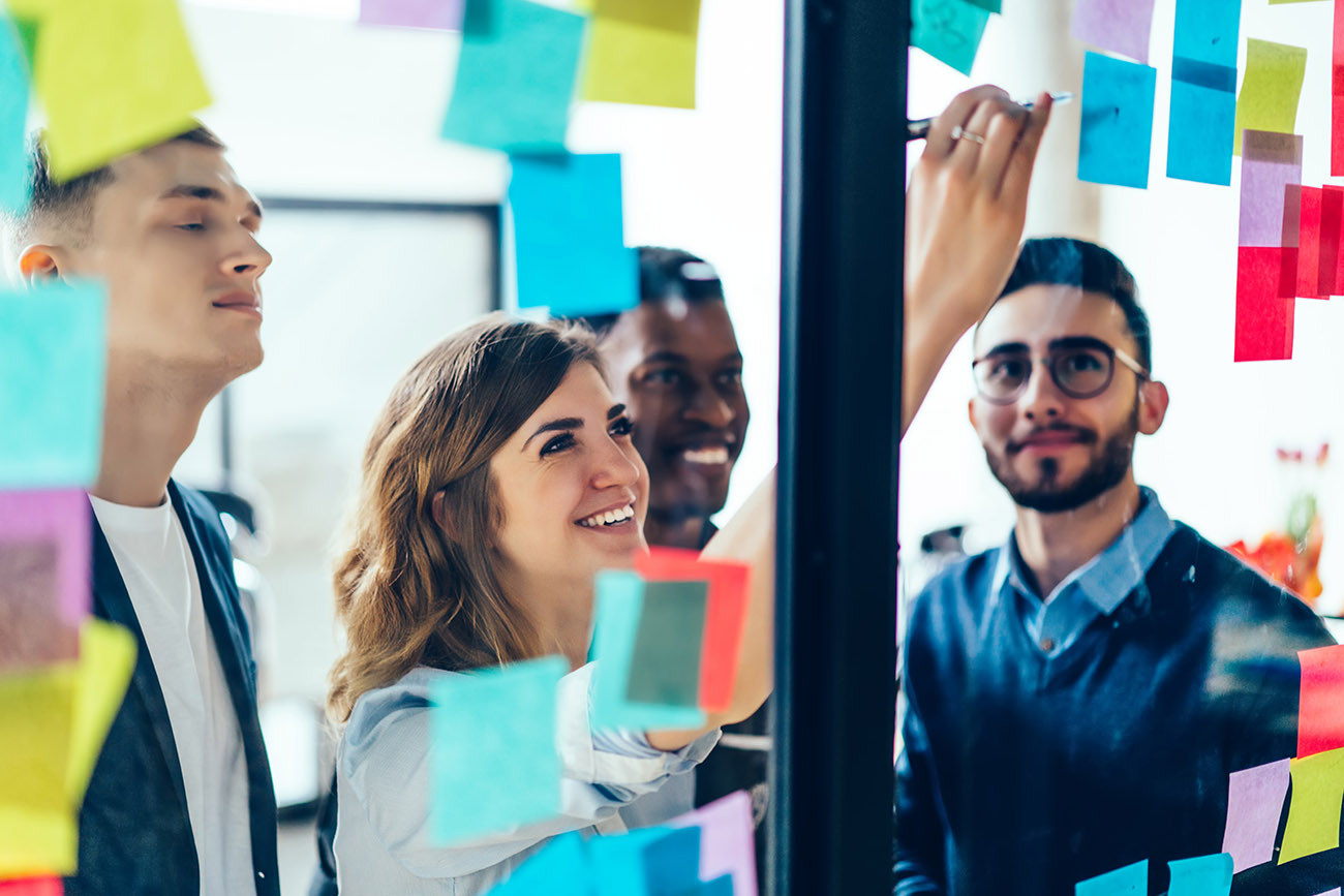 Female manager keeping employees on task with project management