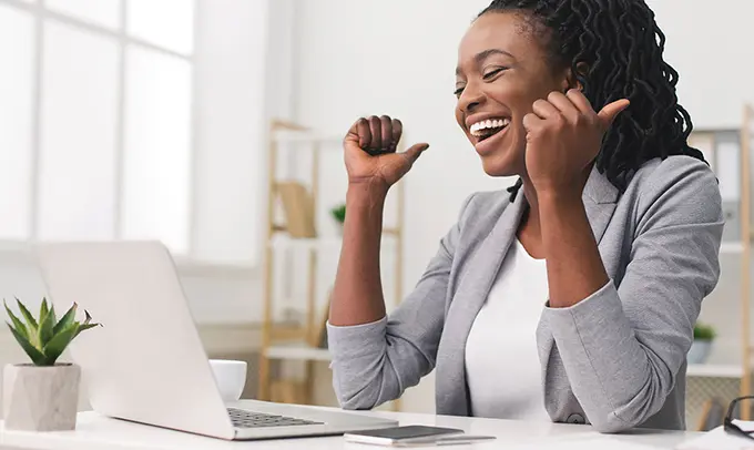 female-manager-upselling-and-celebrating-at-computer