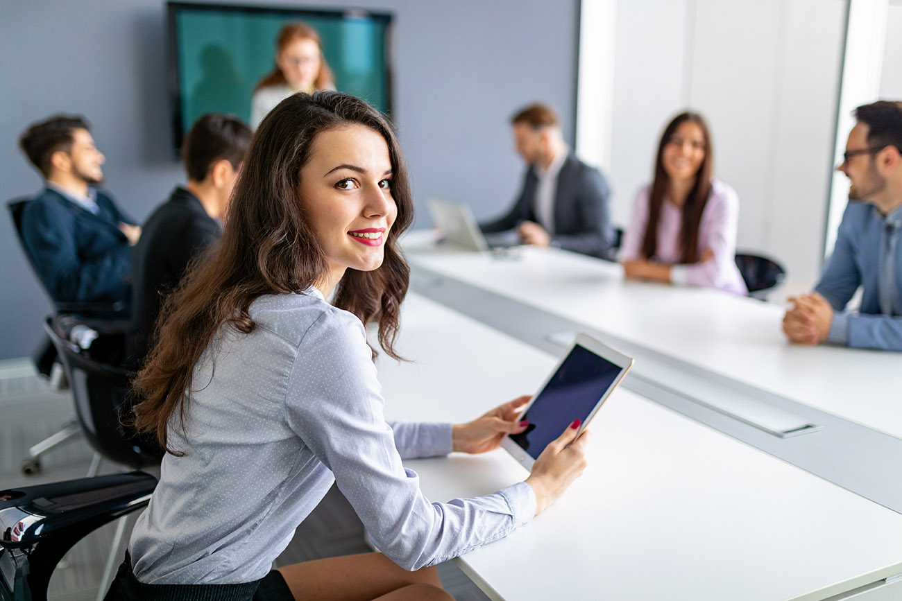 Female professional sitting on sales and marketing meeting