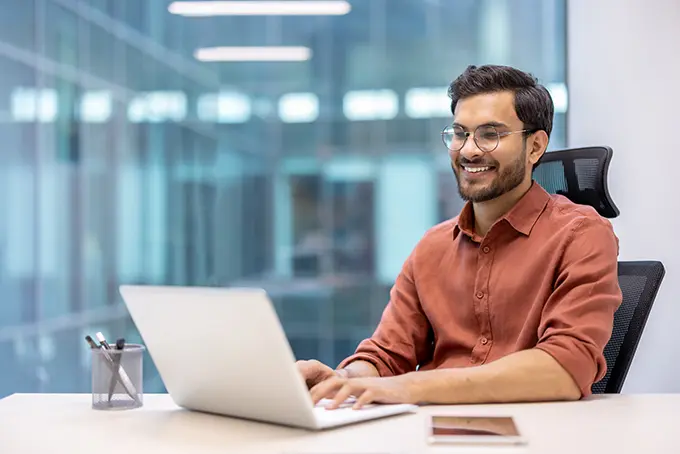 indian-man-developing-crm-in-office