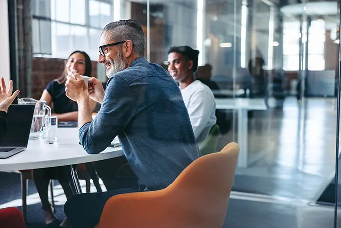 Insurance agents meeting at conference table