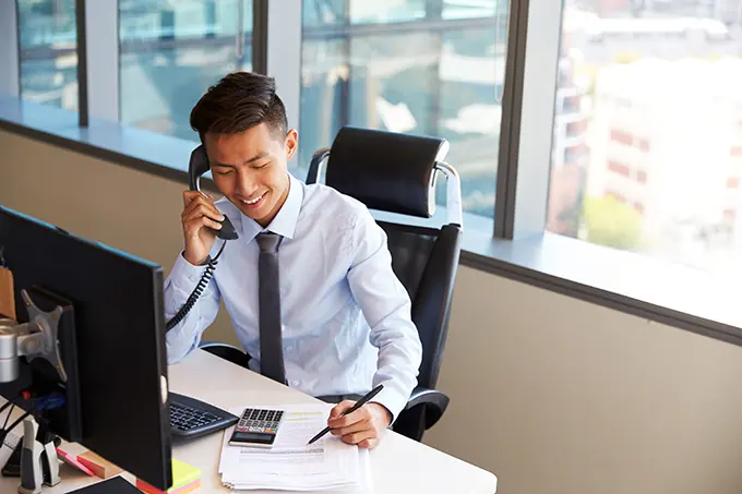 man in office on call