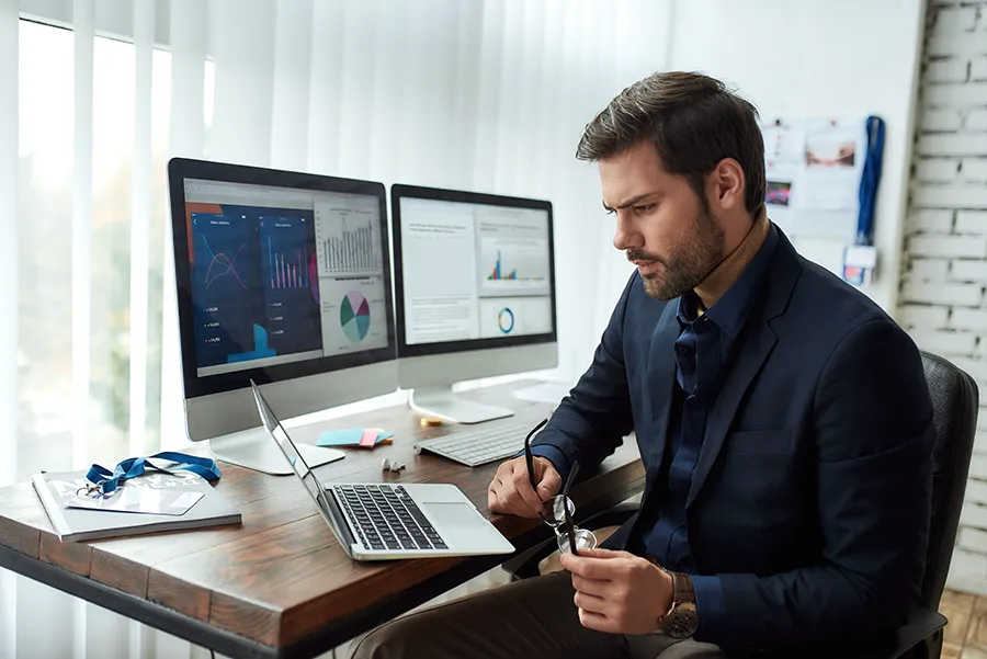 man-using-computer-at-home-and-diagram