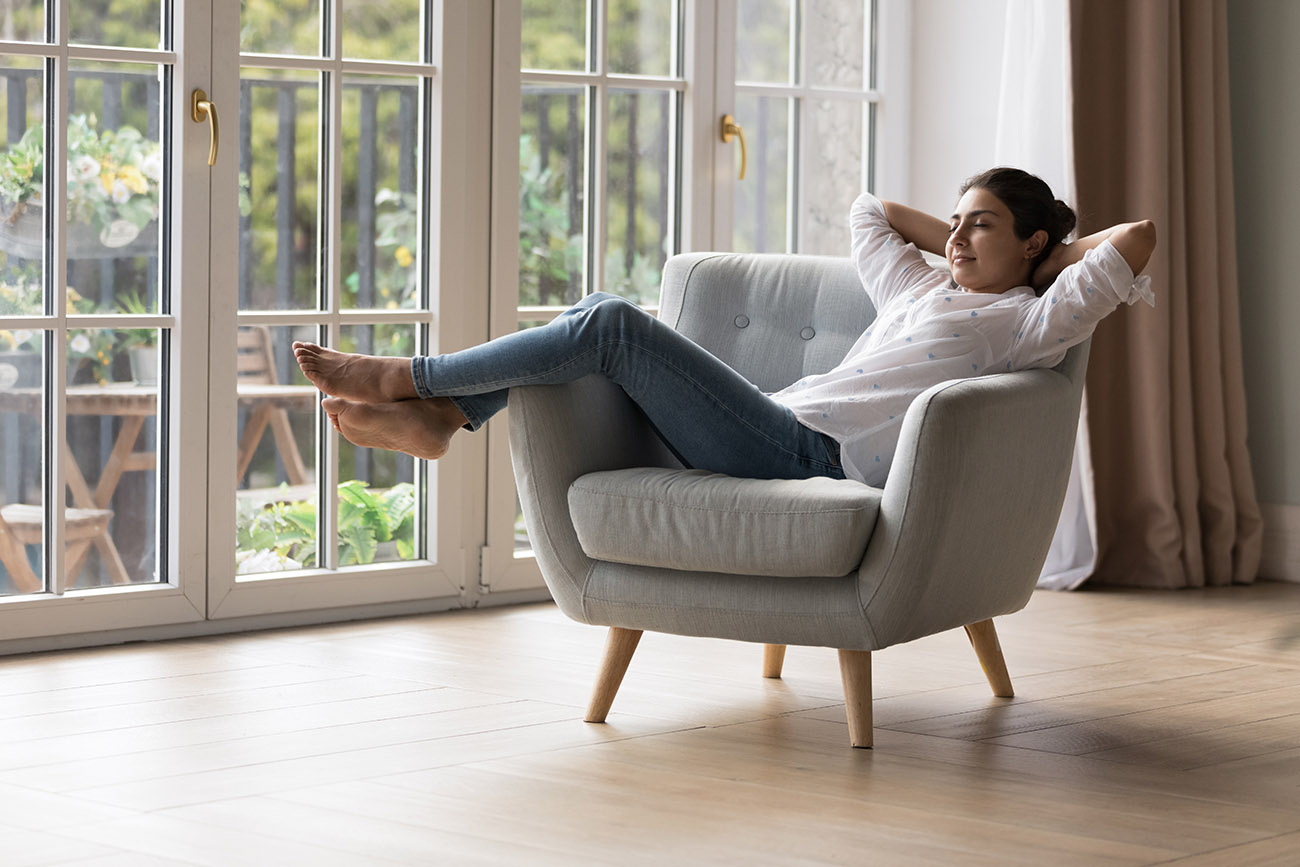 Professional woman relaxing on chair at home