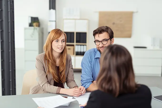 professionals-speaking-in-office-before-meeting