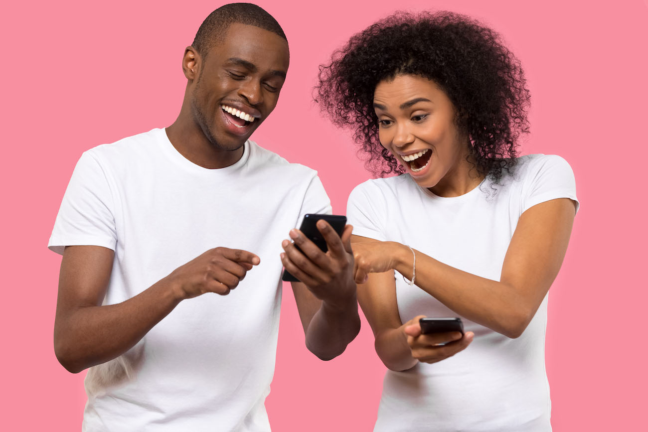 smiling-african-american-couple-on-phones