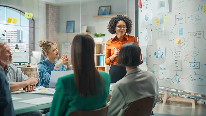 https://images.dyl.com/marketing-blog/team-meeting-in-open-space-conference-room.webp