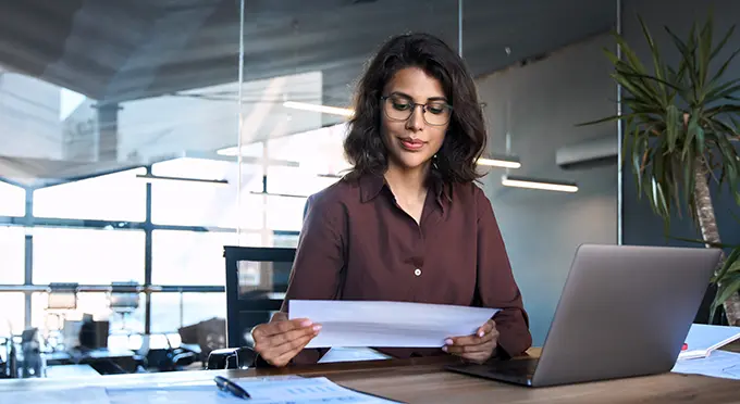 woman-accessing-documents-on-desk