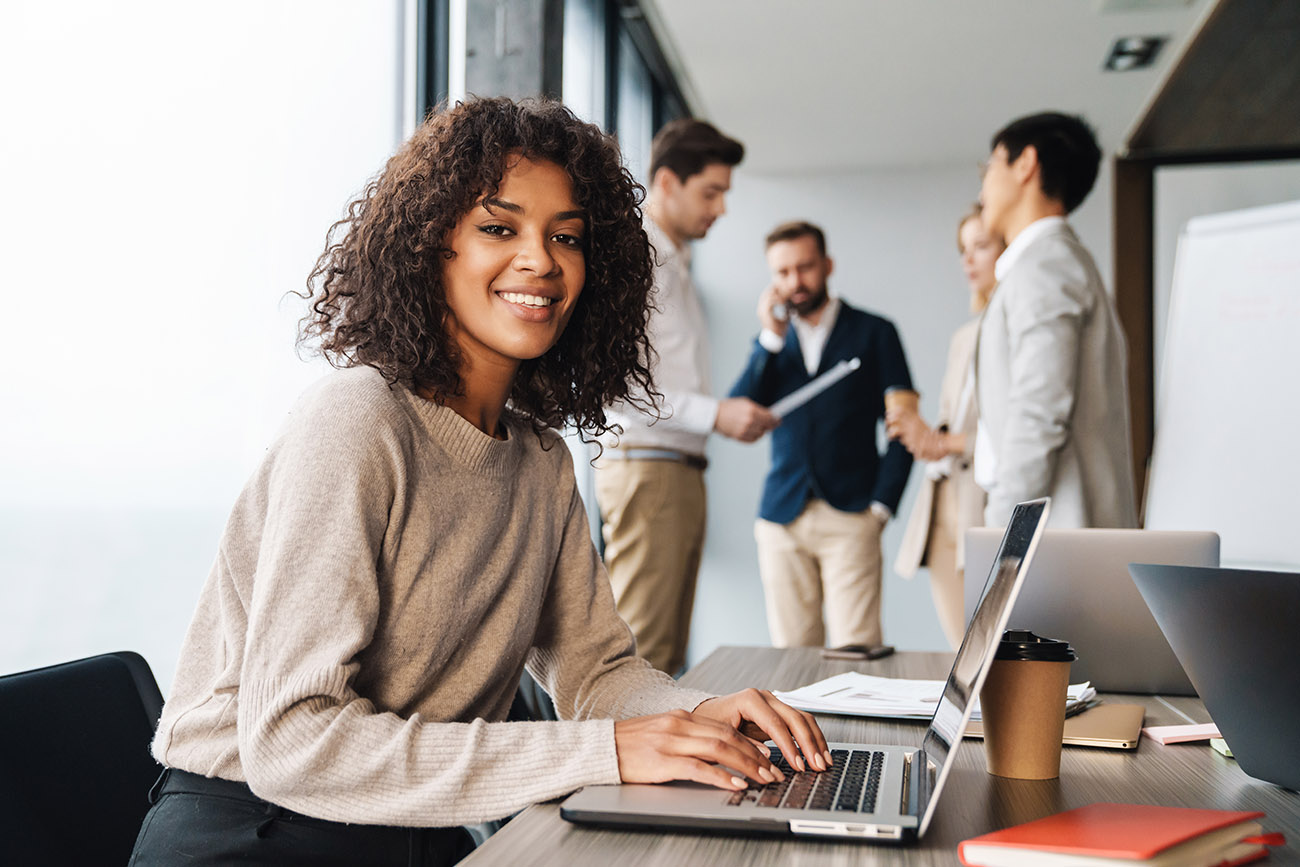 Woman working with sales staff in office