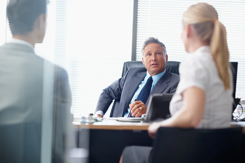 business-man-in-office-speaks-with-staff