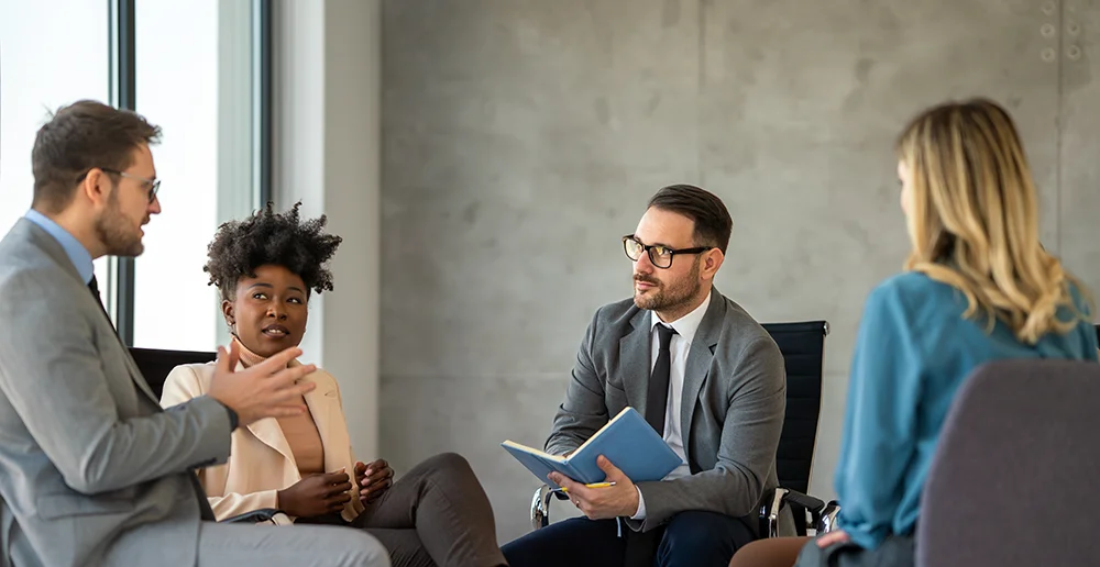 business-man-in-office-speaks-with-staff