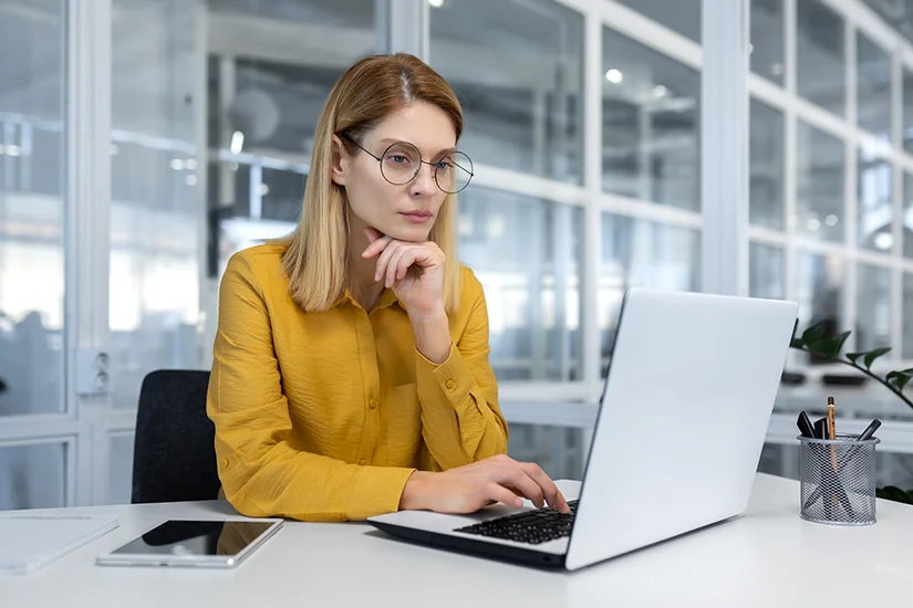 Team member using CRM scheduling software on a laptop