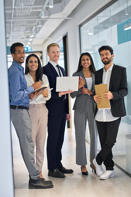 Team collaborating on email software at a computer desk