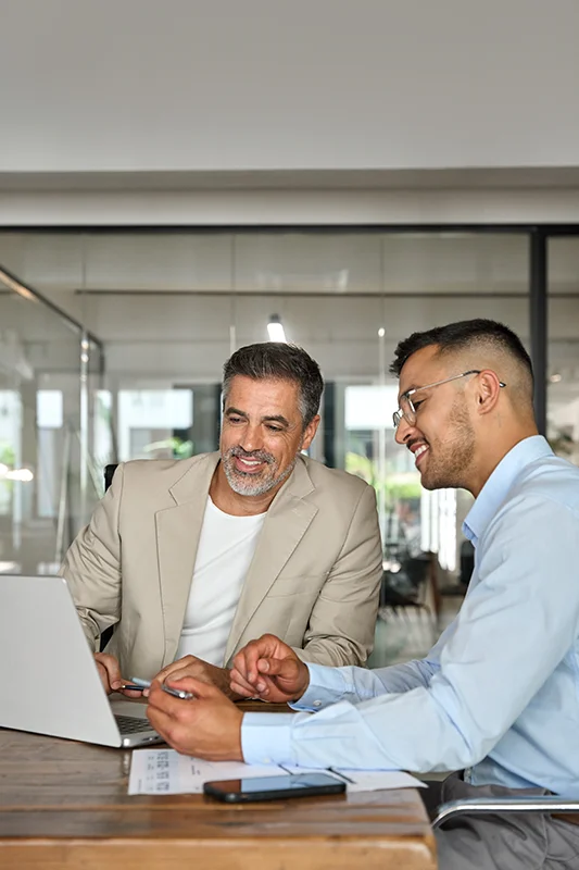 Team collaborating on computer to manage email documents efficiently