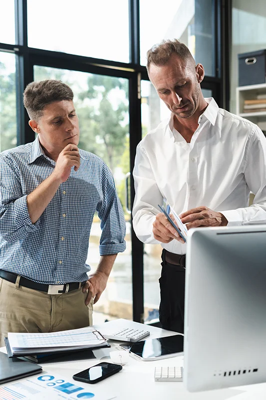 Team collaborating on email software at a computer workstation