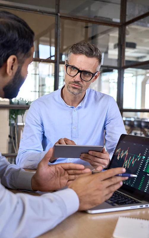 Team collaborating on email marketing strategies using a computer